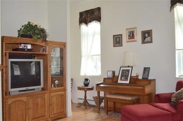 a view of a livingroom with furniture and a window