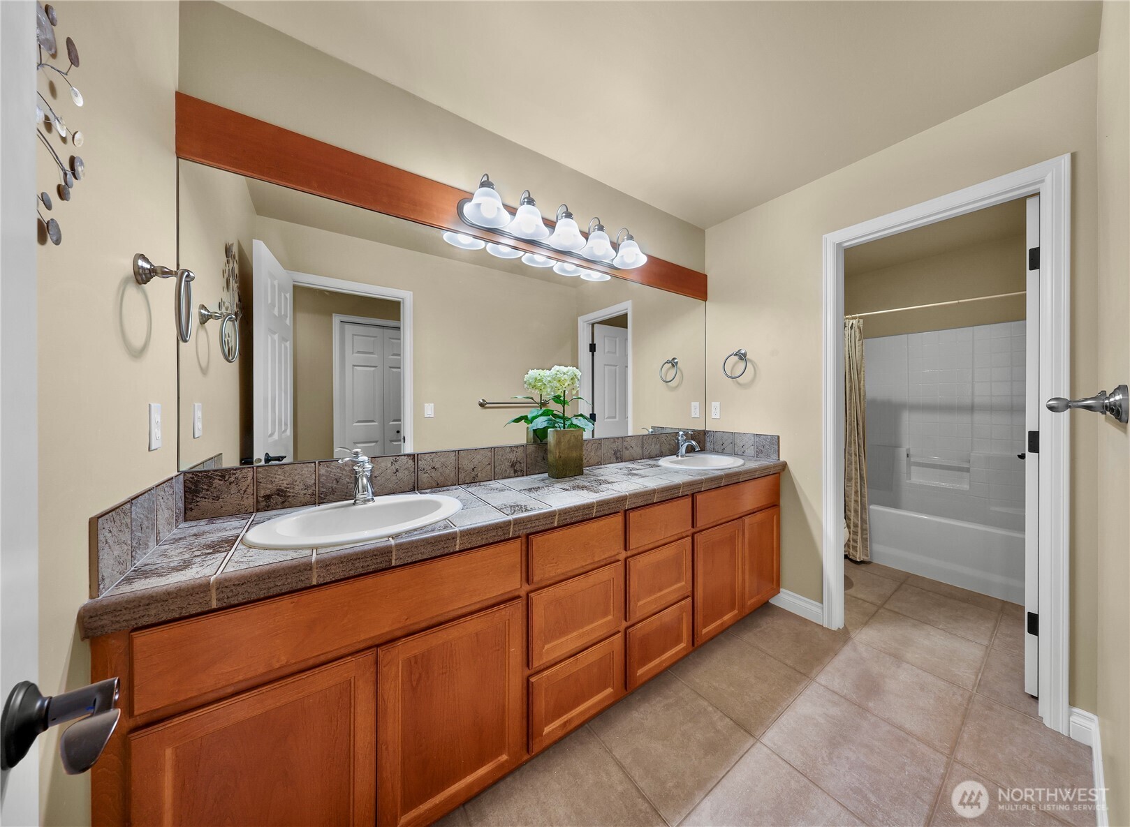 2029 240th Place Southeast Bothell, WA 98021 - Photo 27 of 39 a bathroom with a double vanity sink and a mirror