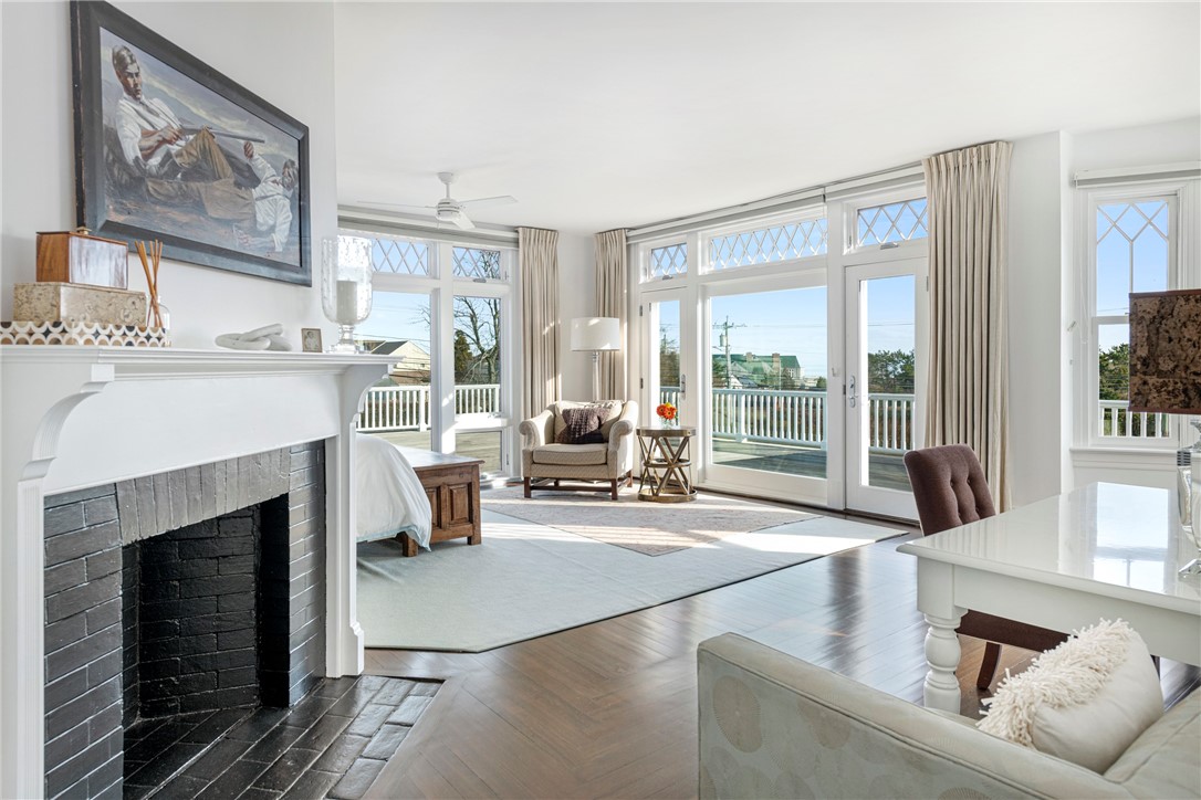 150 Boston Neck Road Narragansett, RI 02882 - Photo 24 of 50 Primary Bedroom with fireplace, ocean views and access to deck