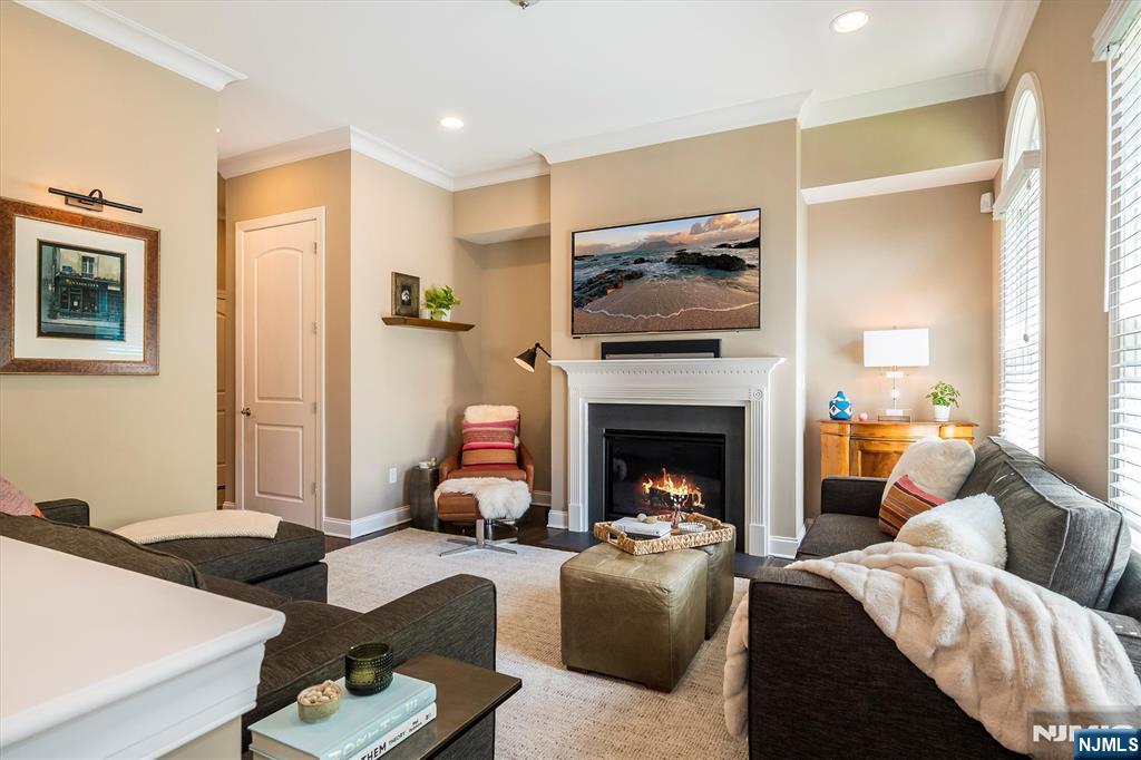 114 Harrison Avenue Montclair, NJ 07042 - Photo 17 of 41 a living room with furniture fireplace and flat screen tv