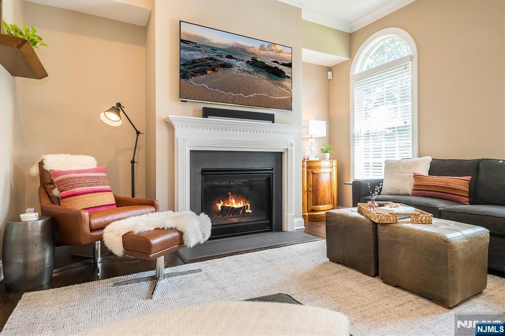 114 Harrison Avenue Montclair, NJ 07042 - Photo 19 of 41 a living room with furniture and a fireplace