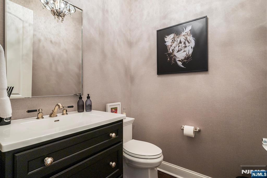 114 Harrison Avenue Montclair, NJ 07042 - Photo 20 of 41 a bathroom with a sink mirror and toilet