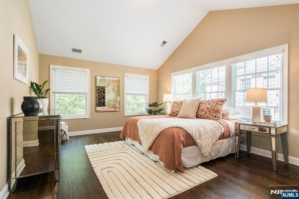 114 Harrison Avenue Montclair, NJ 07042 - Photo 22 of 41 a bedroom with a bed and wooden floor