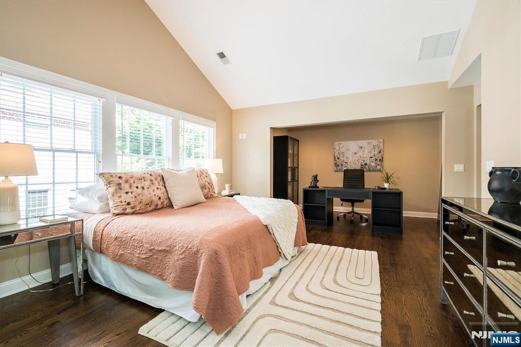 114 Harrison Avenue Montclair, NJ 07042 - Photo 23 of 41 a bedroom with a bed and wooden floor