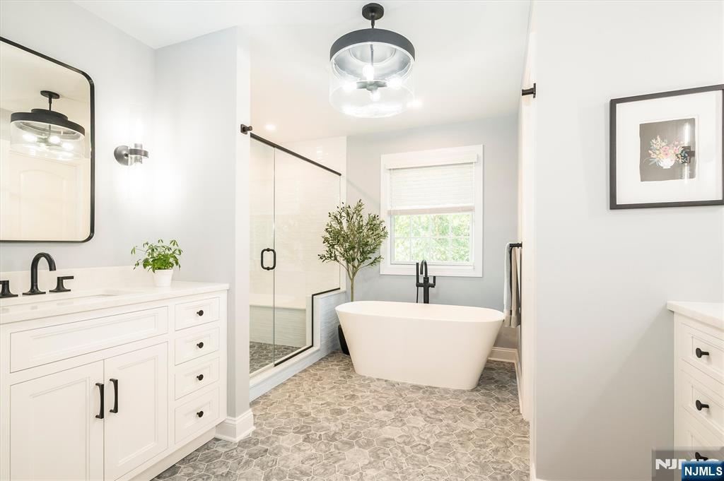 114 Harrison Avenue Montclair, NJ 07042 - Photo 25 of 41 a bathroom with a double vanity sink mirror and bathtub