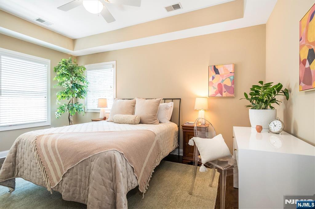 114 Harrison Avenue Montclair, NJ 07042 - Photo 29 of 41 a bedroom with a bed and a potted plant
