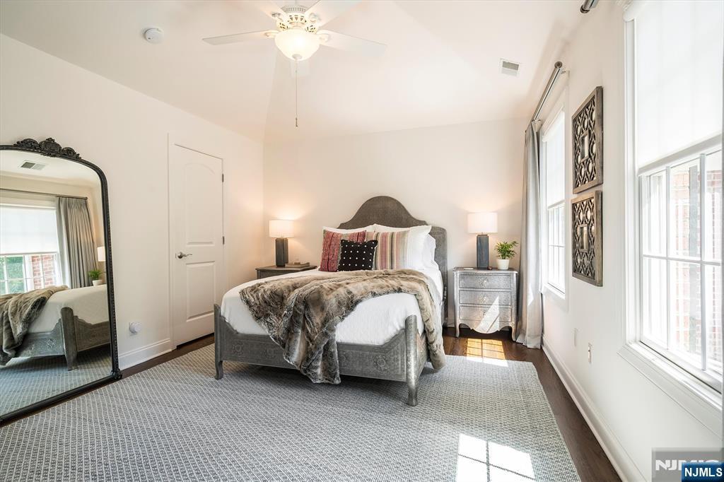 114 Harrison Avenue Montclair, NJ 07042 - Photo 31 of 41 a bedroom with a bed lamp and a large window