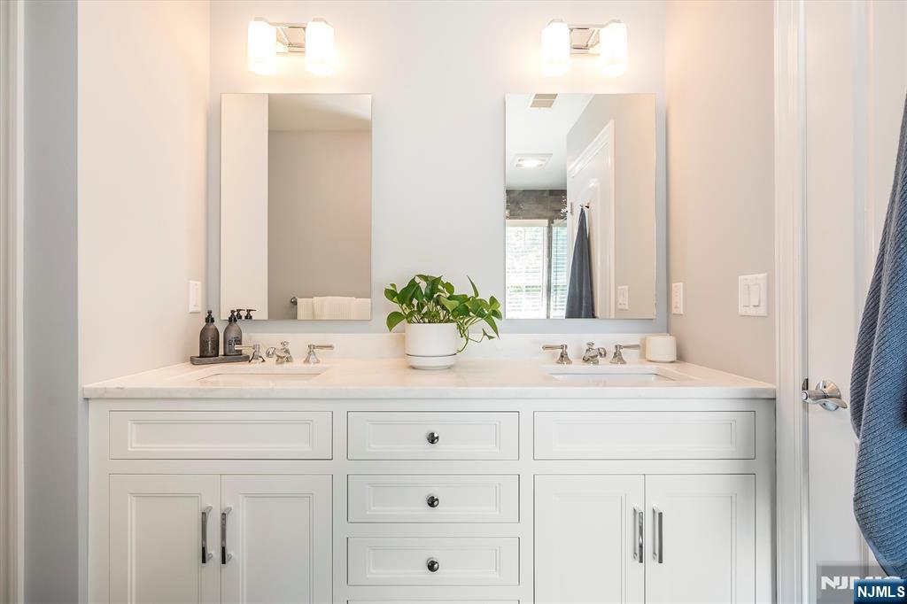 114 Harrison Avenue Montclair, NJ 07042 - Photo 34 of 41 a bathroom with a sink vanity and a mirror