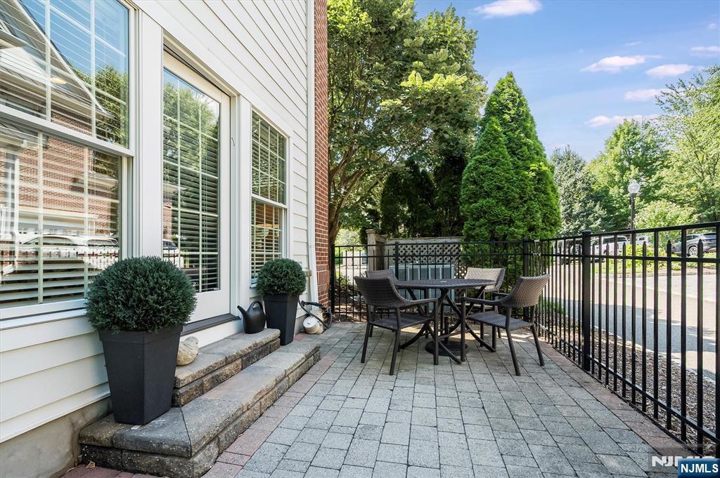 114 Harrison Avenue Montclair, NJ 07042 - Photo 40 of 41 a view of a patio with table and chairs and potted plants