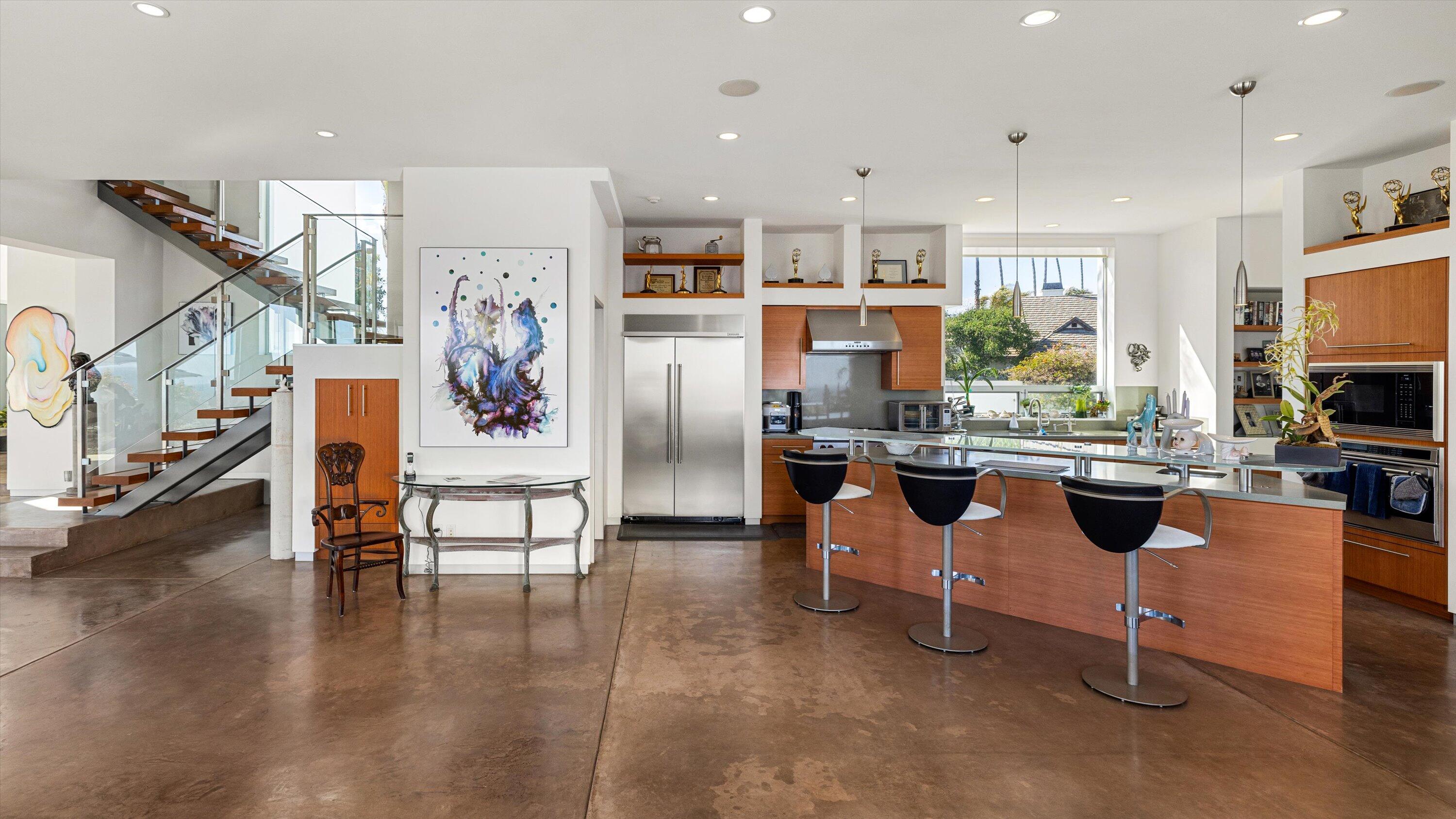 5297 Austin Road Santa Barbara, CA 93111 - Photo 11 of 35 a kitchen with stainless steel appliances kitchen island granite countertop a refrigerator and a stove top oven