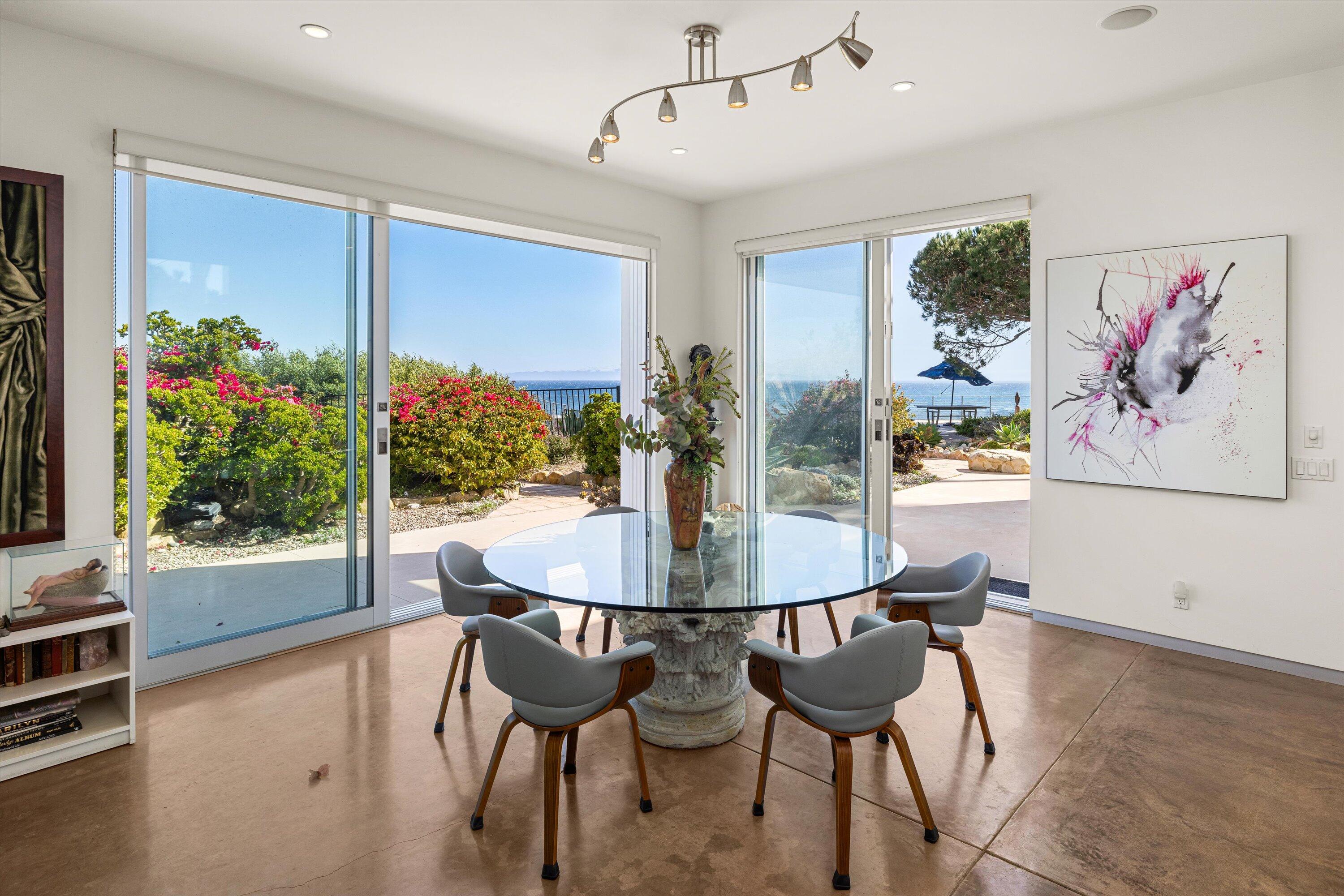 5297 Austin Road Santa Barbara, CA 93111 - Photo 13 of 35 a view of a dining room with furniture and a potted plant