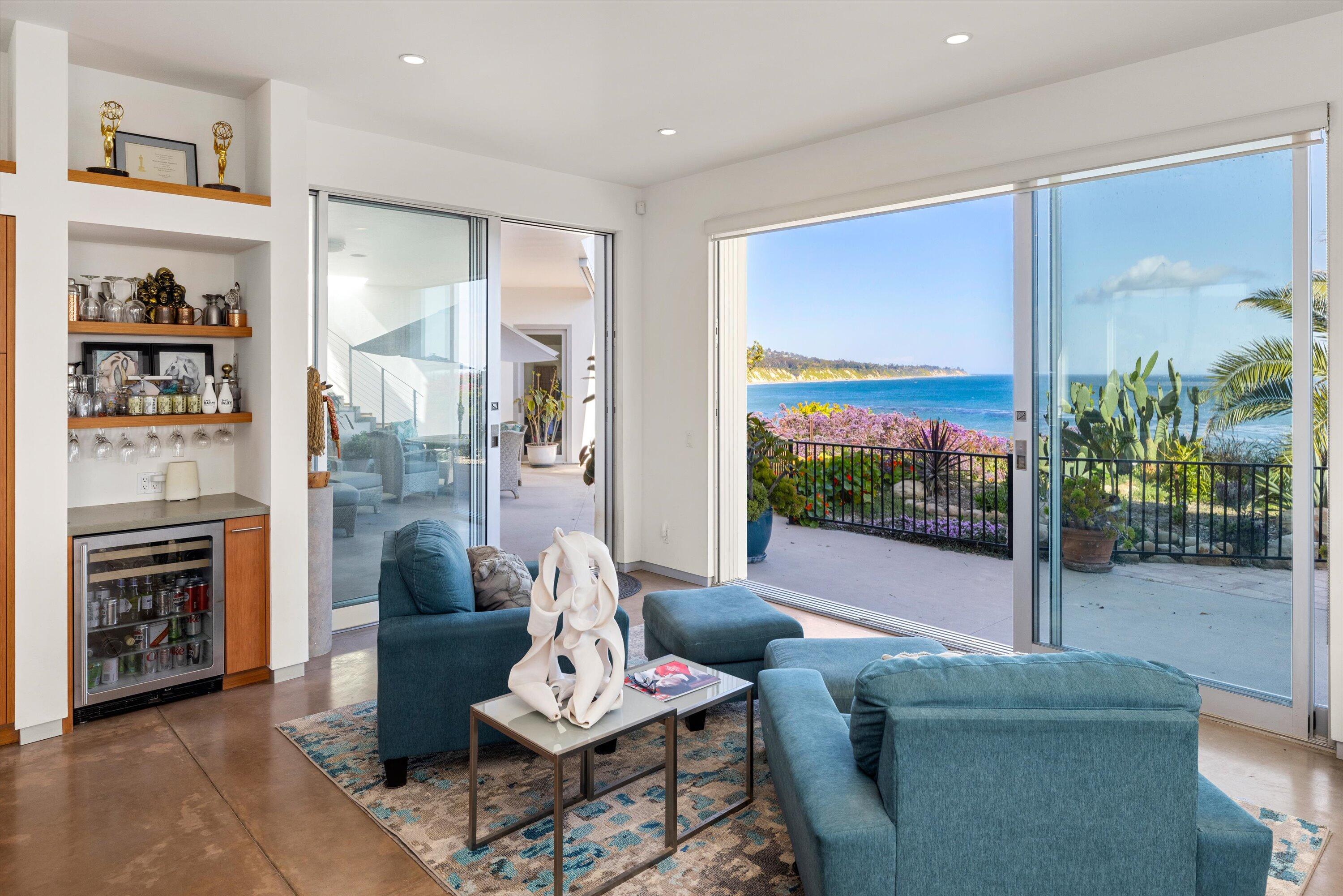 5297 Austin Road Santa Barbara, CA 93111 - Photo 14 of 35 a living room with furniture a floor to ceiling window and floor to ceiling window