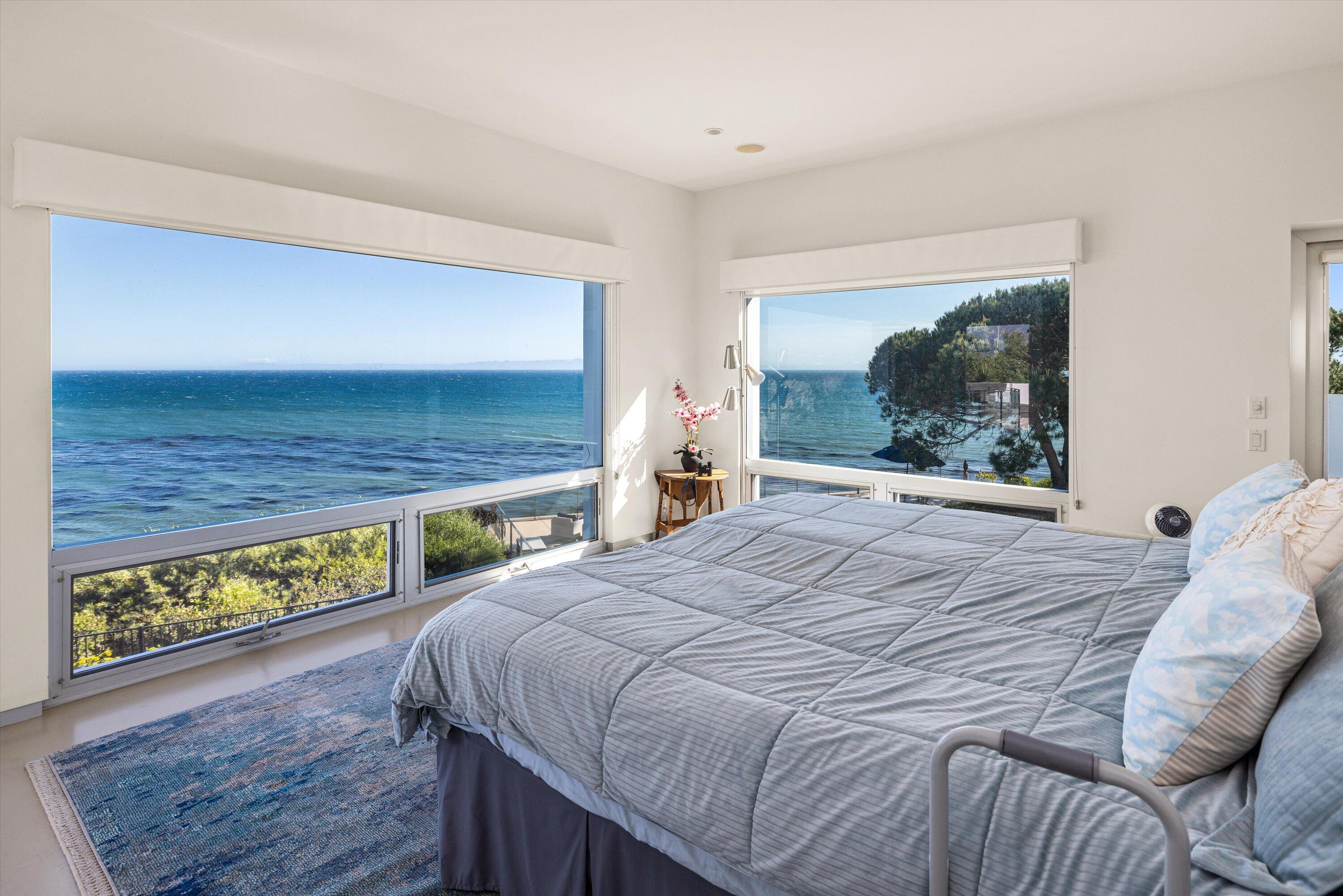 5297 Austin Road Santa Barbara, CA 93111 - Photo 16 of 35 a bed sitting in a bedroom next to a window