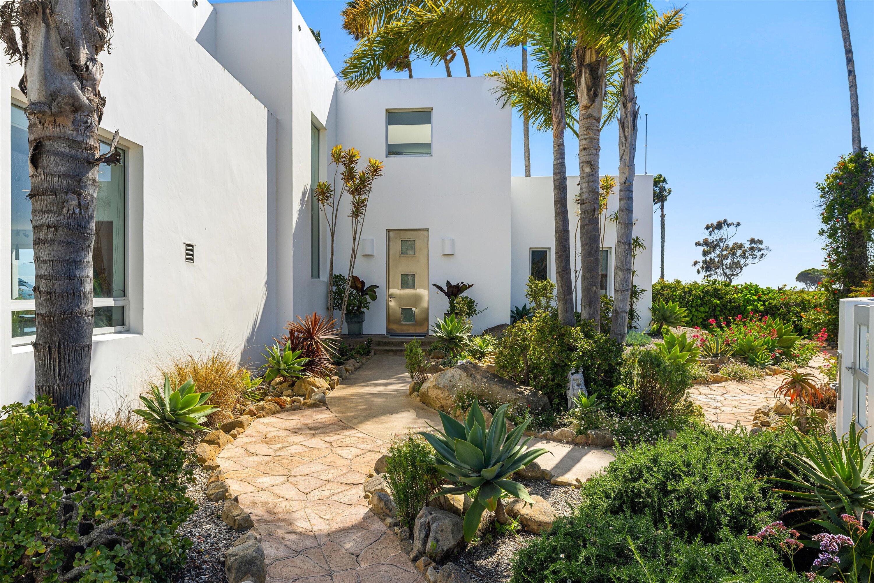 5297 Austin Road Santa Barbara, CA 93111 - Photo 4 of 35 a couple of flower plants in front of house