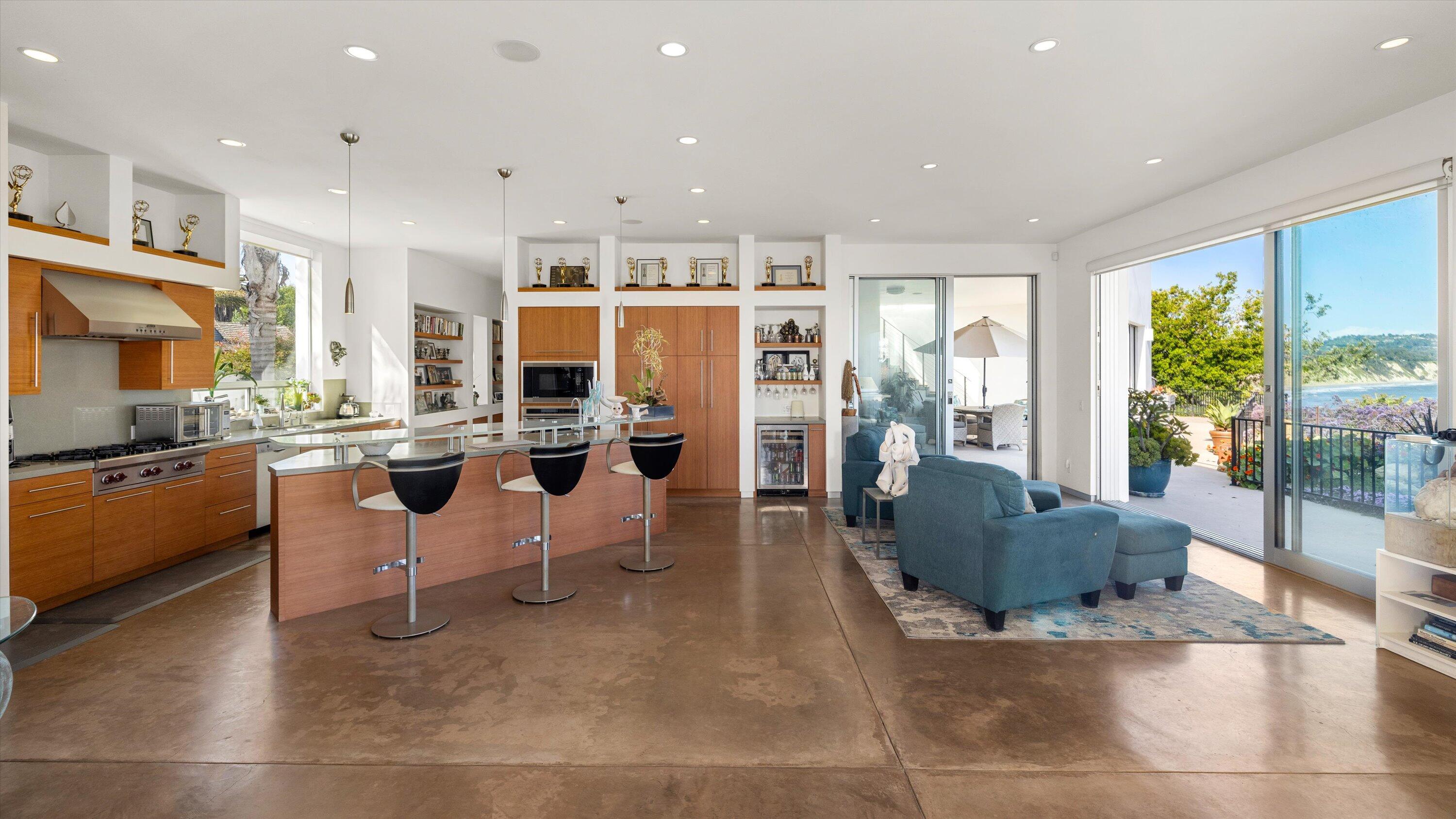 5297 Austin Road Santa Barbara, CA 93111 - Photo 10 of 35 a living room with fireplace furniture and a large window