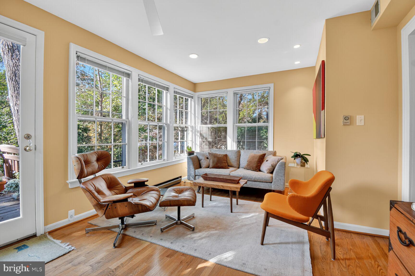 14 Cleveland Avenue Takoma Park, MD 20912 - Photo 15 of 41 a living room with furniture and a floor to ceiling window