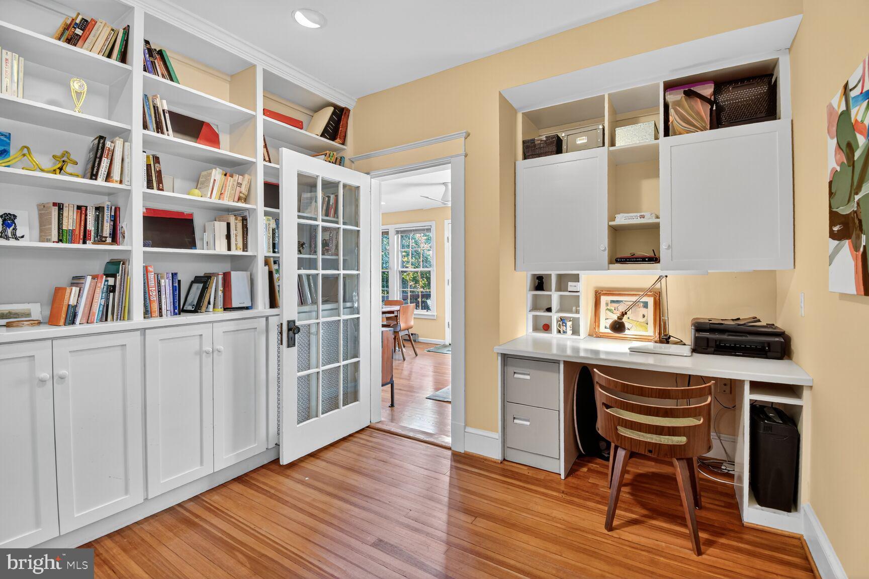 14 Cleveland Avenue Takoma Park, MD 20912 - Photo 22 of 41 a view of a workspace with furniture and a book shelf