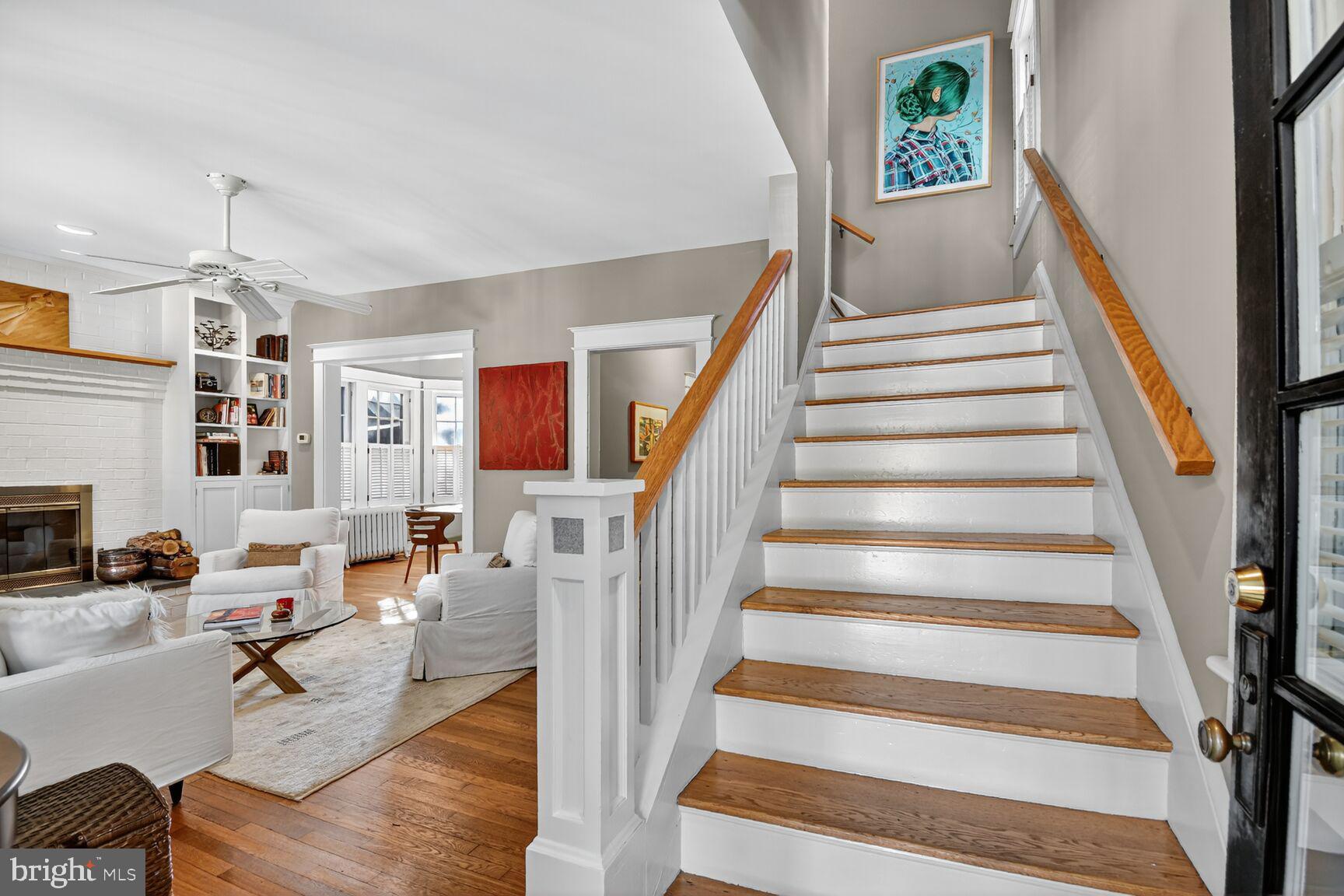 14 Cleveland Avenue Takoma Park, MD 20912 - Photo 24 of 41 a living room with furniture and a chandelier