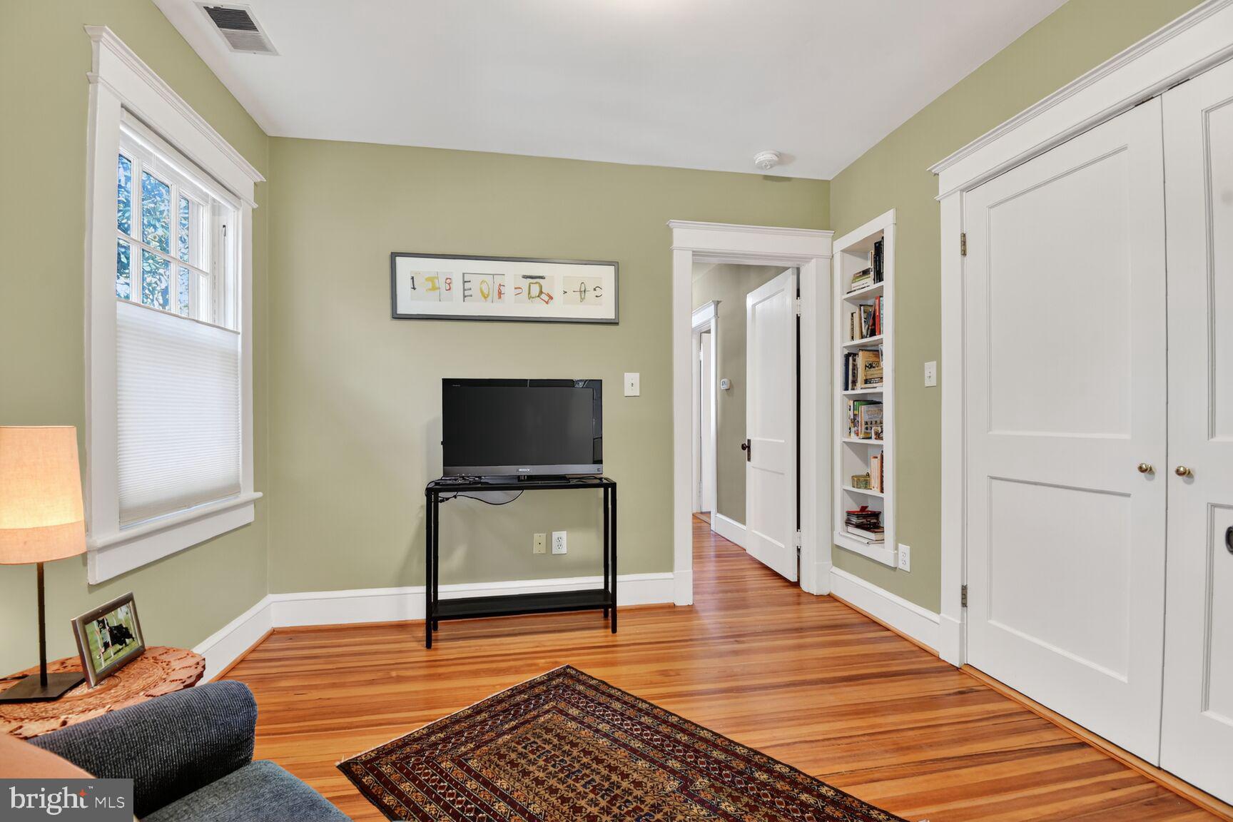 14 Cleveland Avenue Takoma Park, MD 20912 - Photo 30 of 41 a living room with furniture and a flat screen tv
