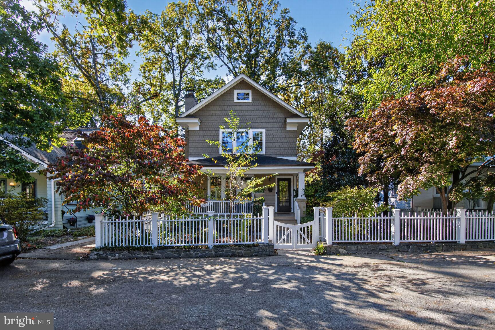14 Cleveland Avenue Takoma Park, MD 20912 - Photo 4 of 41 a front view of a house with a yard and garage