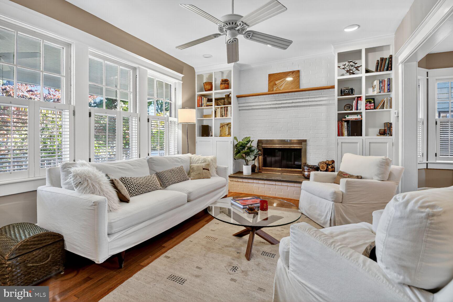 14 Cleveland Avenue Takoma Park, MD 20912 - Photo 8 of 41 a living room with furniture a fireplace and a large window