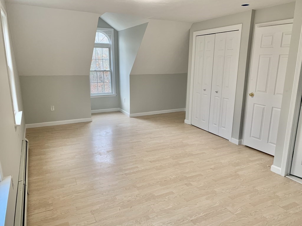 76 Old Douglas Road Webster, MA 01570 - Photo 14 of 22 an empty room with windows and closet