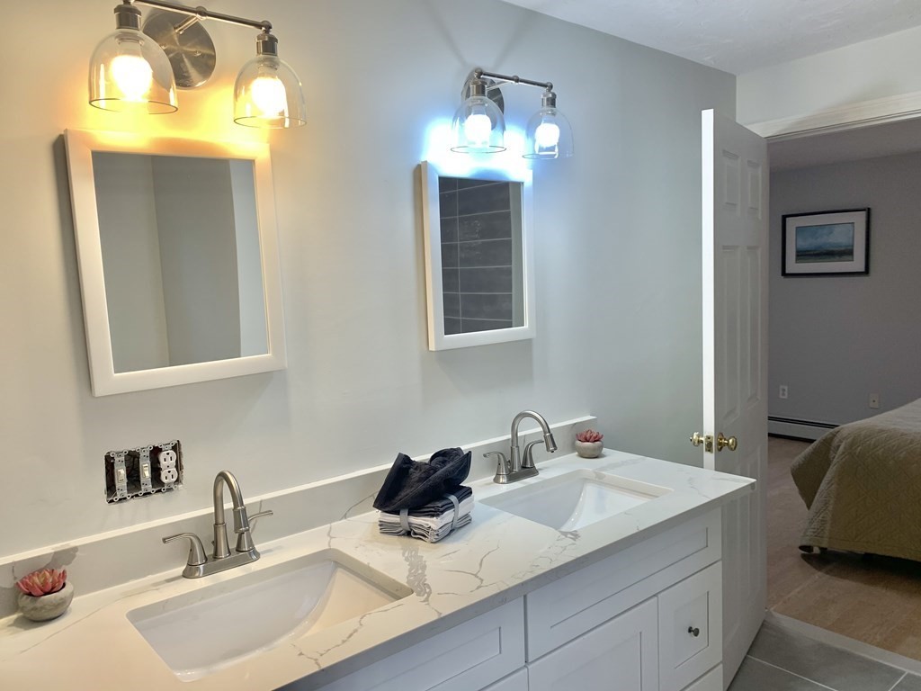 76 Old Douglas Road Webster, MA 01570 - Photo 15 of 22 a bathroom with a sink and a mirror