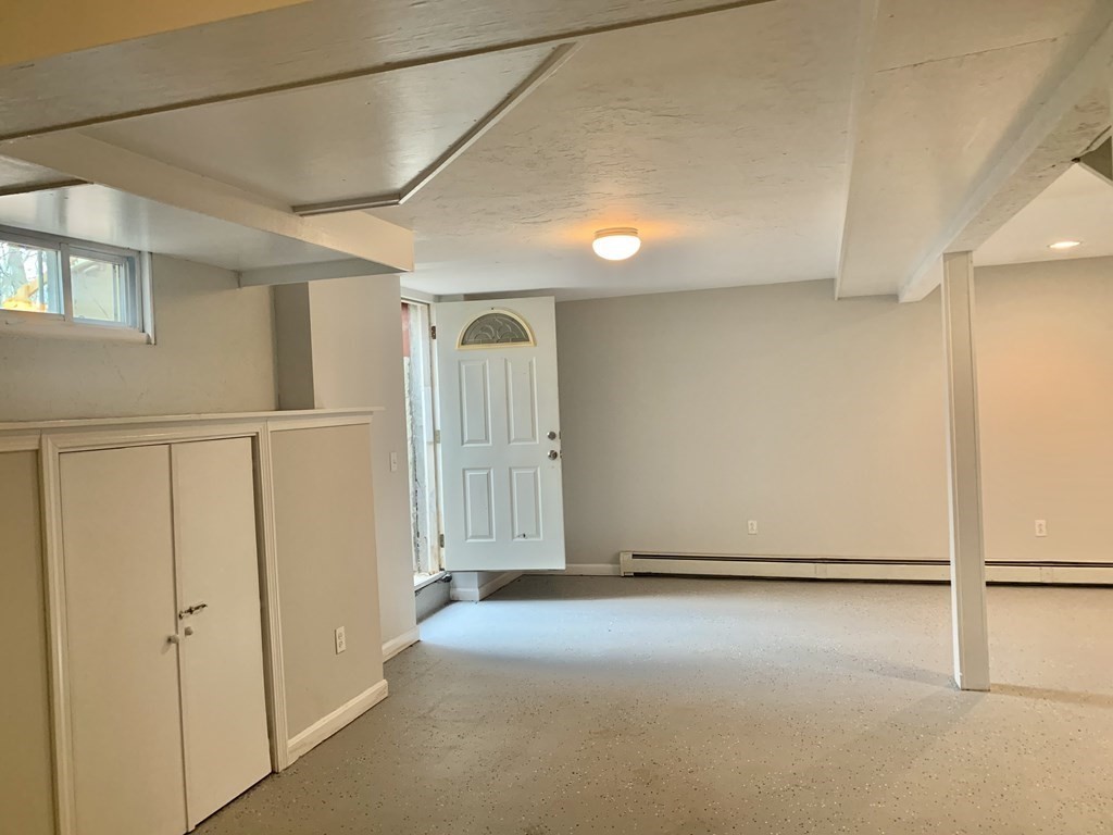 76 Old Douglas Road Webster, MA 01570 - Photo 18 of 22 an empty room with windows