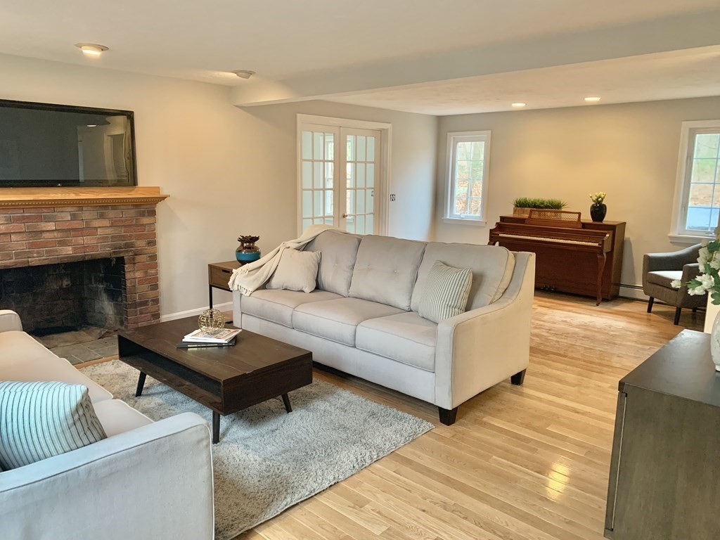 76 Old Douglas Road Webster, MA 01570 - Photo 2 of 22 a living room with furniture fireplace and flat screen tv