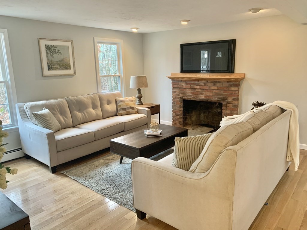 76 Old Douglas Road Webster, MA 01570 - Photo 3 of 22 a living room with furniture and a fireplace