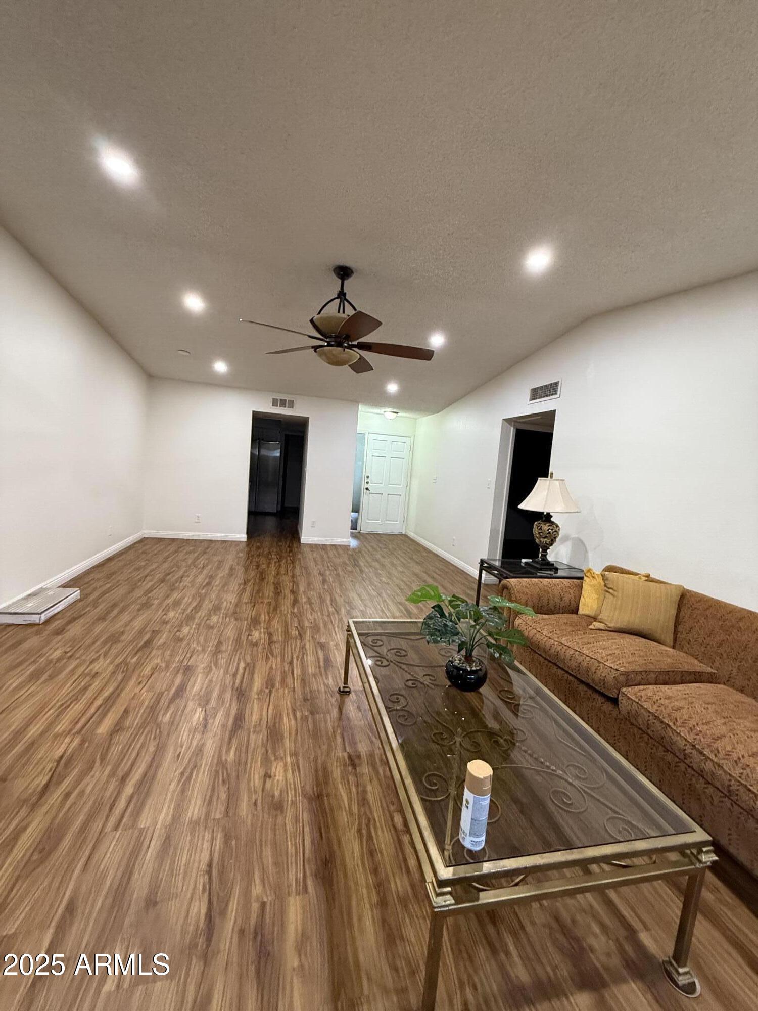 3033 North 37th Street, Unit 12 Phoenix, AZ 85018 - Photo 2 of 11 a living room with furniture