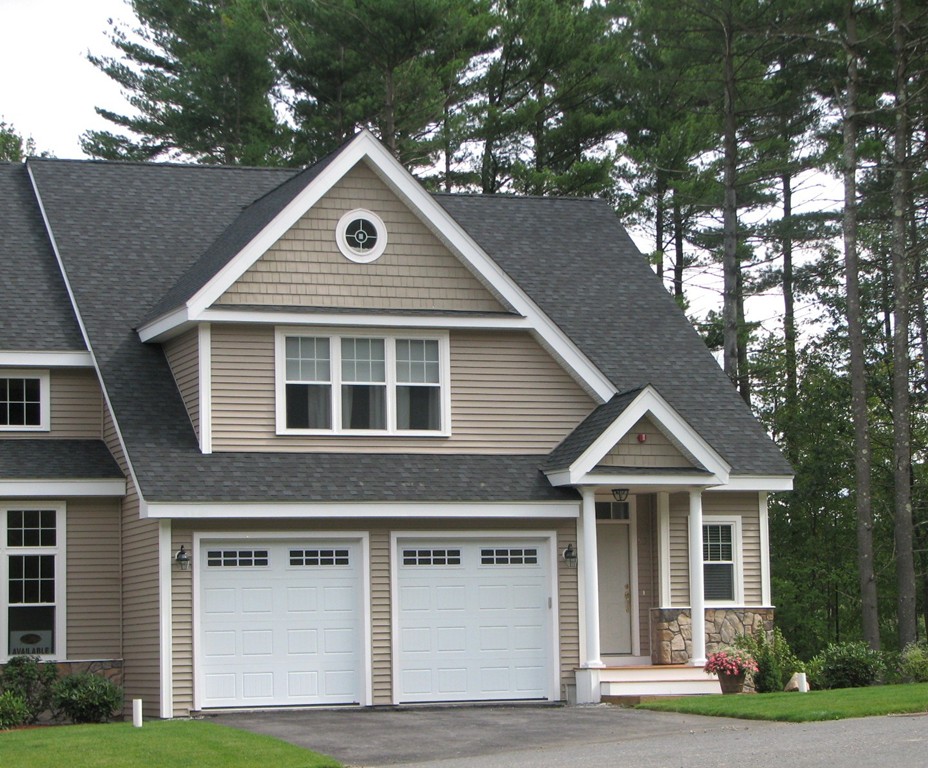 3 C Trail Ridge Way, Unit 7 Harvard, MA 01451 - Photo 1 of 30 a front view of a house with garage and yard