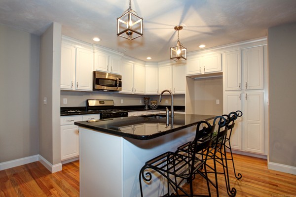 3 C Trail Ridge Way, Unit 7 Harvard, MA 01451 - Photo 11 of 30 a kitchen with stainless steel appliances granite countertop a stove top oven a sink a stove and a refrigerator