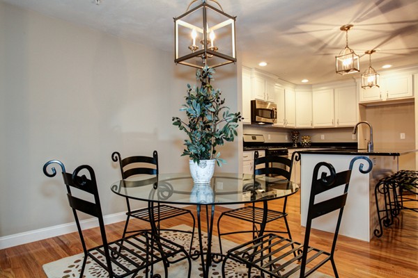 3 C Trail Ridge Way, Unit 7 Harvard, MA 01451 - Photo 16 of 30 a dining room with furniture and wooden floor
