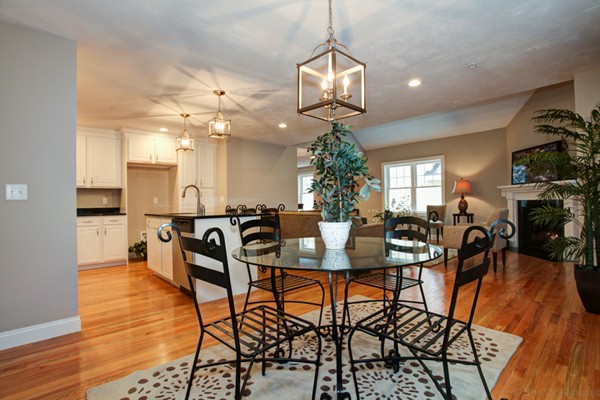 3 C Trail Ridge Way, Unit 7 Harvard, MA 01451 - Photo 17 of 30 a view of a dining room and livingroom with furniture wooden floor a chandelier
