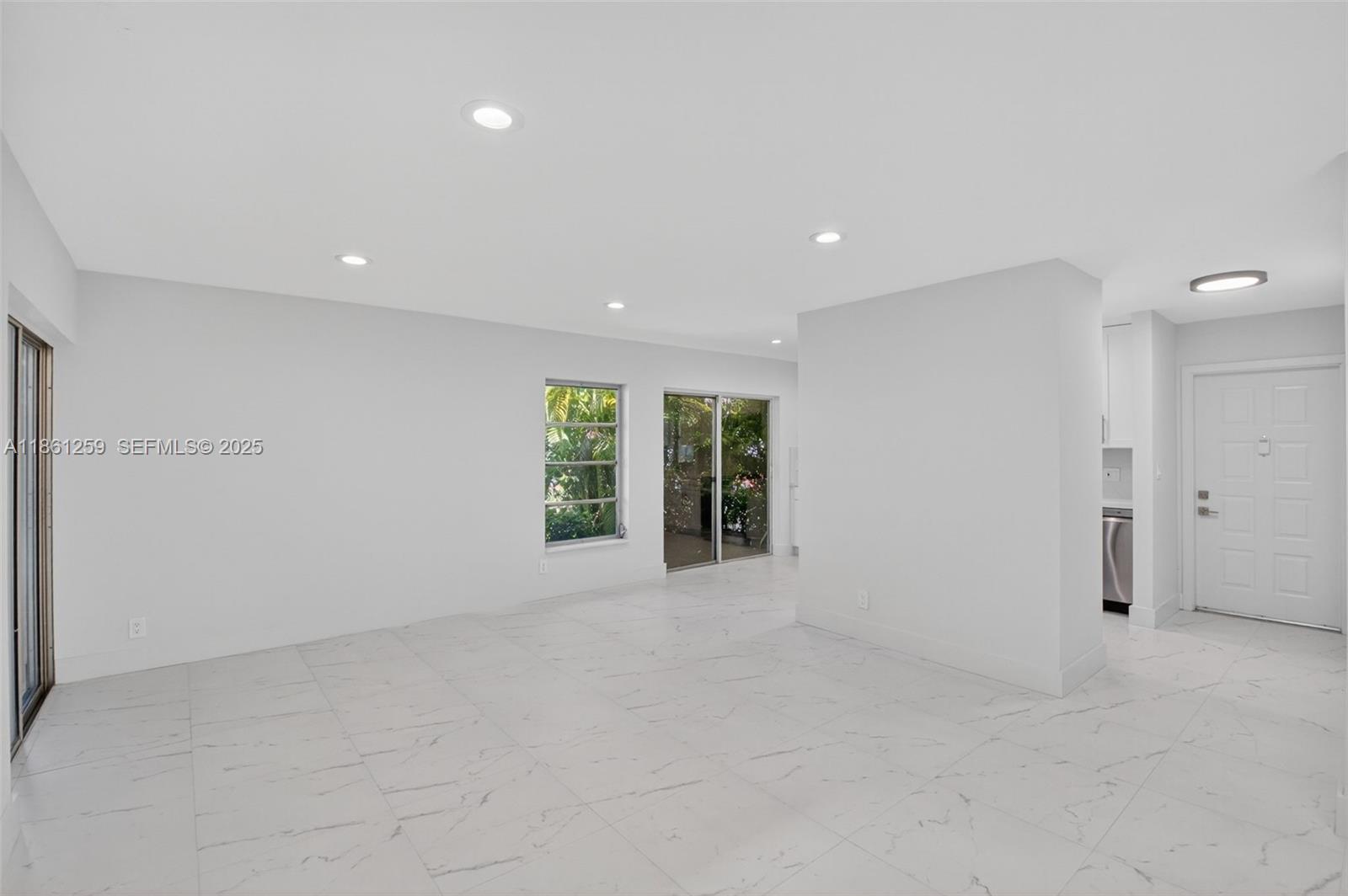 8840 Rheims Road Boca Raton, FL 33496 - Photo 5 of 41 a view of an empty room with a window