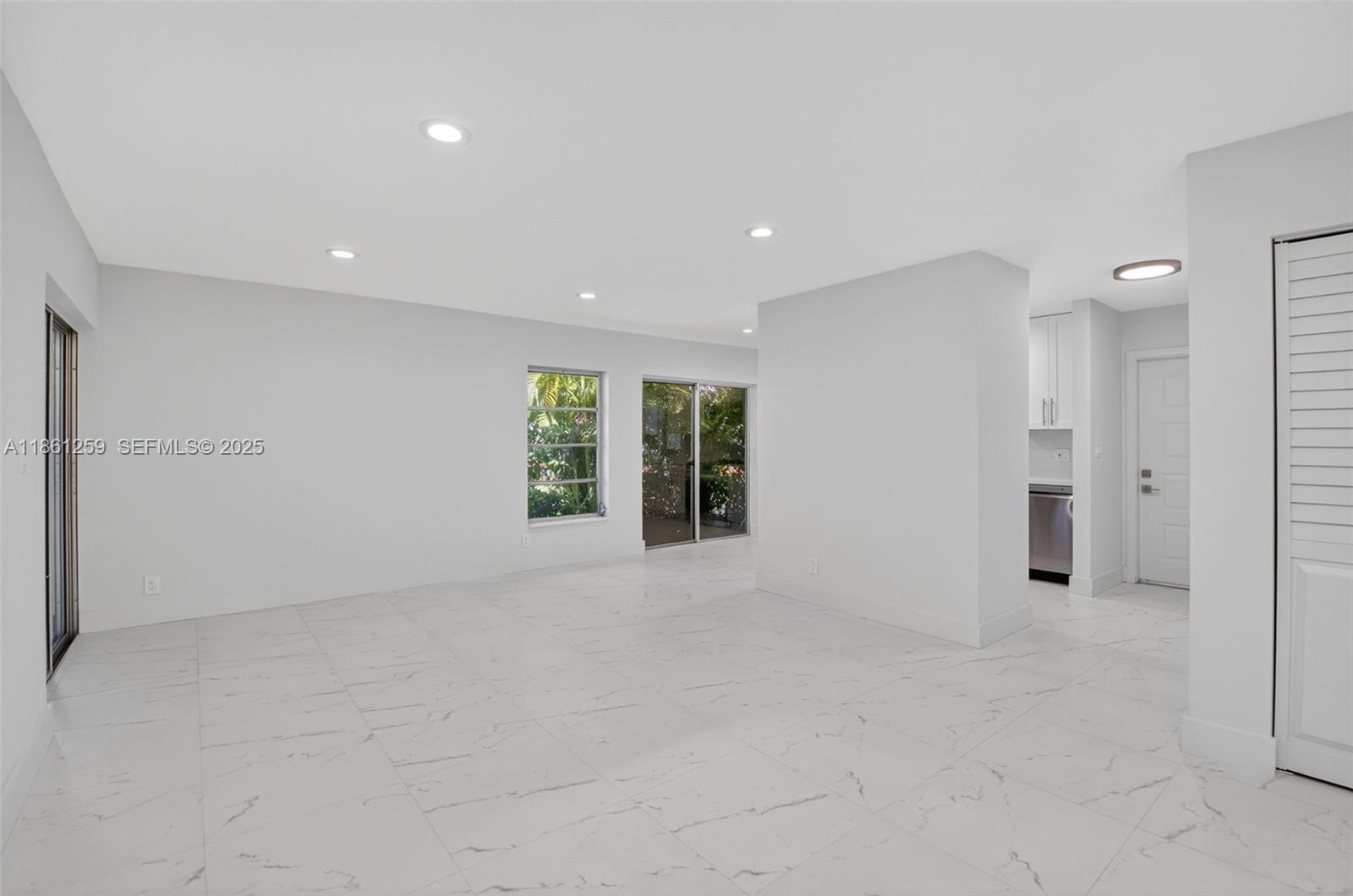 8840 Rheims Road Boca Raton, FL 33496 - Photo 7 of 41 a view of an empty room with a window