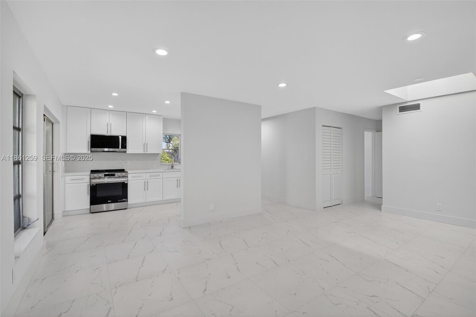 8840 Rheims Road Boca Raton, FL 33496 - Photo 9 of 41 a view of a kitchen with a sink oven and cabinets