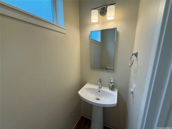 a bathroom with a sink and mirror