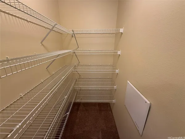 a view of a room with racks on the wall