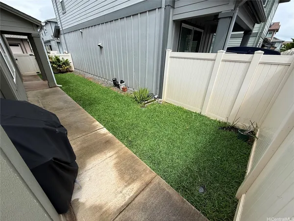 a view of backyard with small cabin