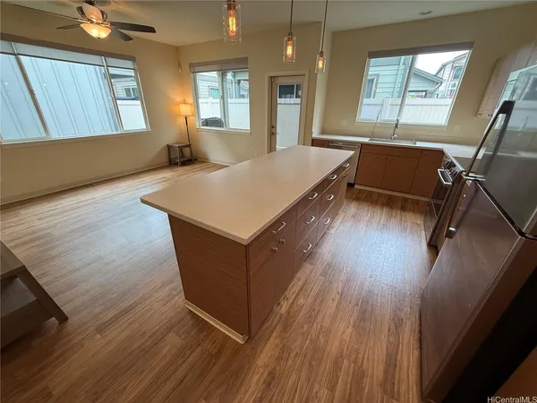 a room with wooden floors and windows
