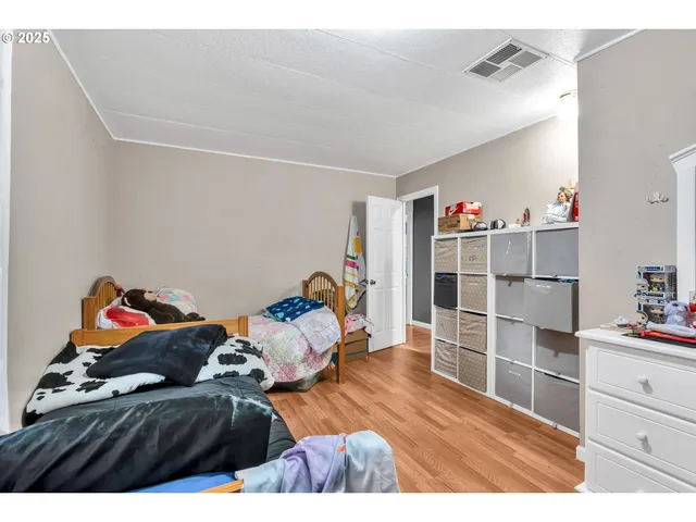 a bedroom with a bed and closet