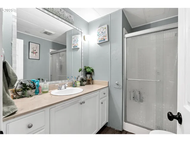 a bathroom with a sink and mirror