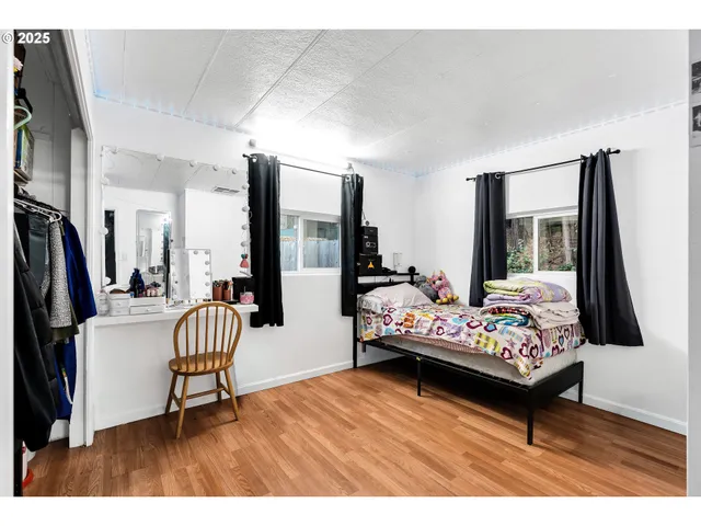 a living room with furniture rug and a flat screen tv