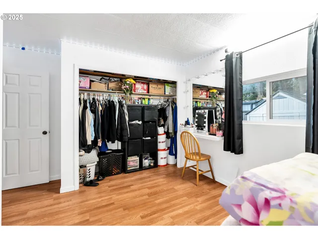 a bed room with a bed and a window