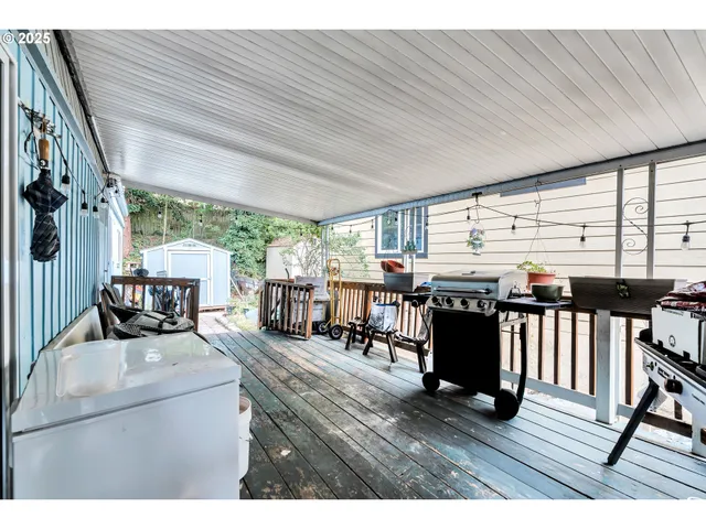 a living room with lots of furniture and a wooden floor