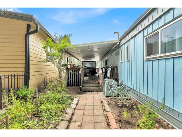a view of a porch with a table and chairs