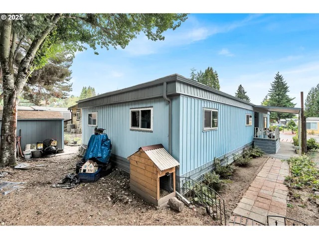 a backyard of a house with barbeque oven fire pit and outdoor seating