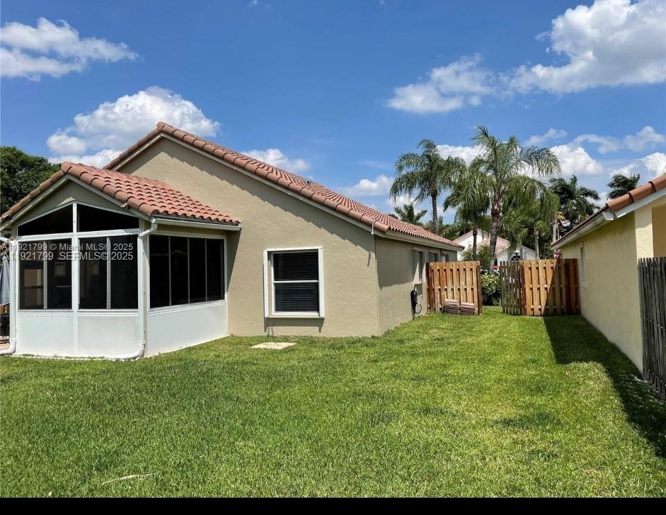 1972 Oak Berry Circle, Unit 1972 Wellington, FL 33414 - Photo 13 of 13 a house with trees in the background